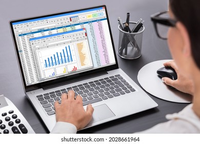 Business Woman Working With Spreadsheet Graphs On Computer