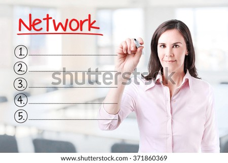 Business woman writing blank Network list. Office background. 