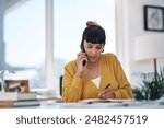 Business woman, writing and phone call with documents for query, question or reminder on financial payments at office. Young female person taking notes or settling debt with book on mobile smartphone