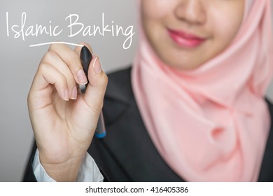 Business Woman Writing Text : Islamic Banking Over Gray Background