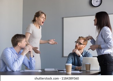 Business women colleagues disputing arguing at corporate office meeting, mad angry shocked female employee disagree with coworker blaming for bad work, conflict and rivalry at workplace concept