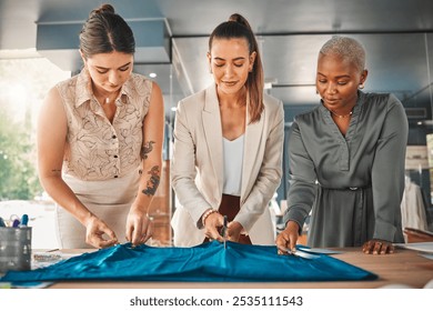 Business, women and cutting fabric as fashion designer at office with patterns or clothes for project . Startup, employees and creative director with teamwork, collaboration and coworking as stylist - Powered by Shutterstock