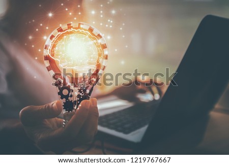 Business women hand holding light bulb, concept of new ideas with innovation and creativity / soft focus picture / Vintage concept	