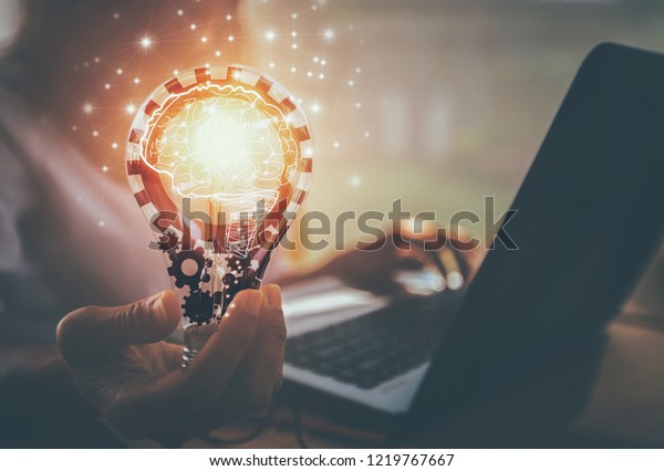 Business women hand holding light bulb, concept of new ideas with innovation and creativity / soft focus picture / Vintage concept	