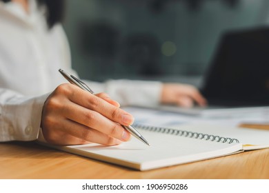 Business Women Hand And Notepads Placed On The Table In The Office, Writing Ideas And Taking Notes