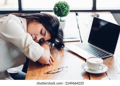 Business women lifestyle freelance he has resting sleeping after hard work long time in coffee shop, Sleepy tired overworked exhaustion and stress