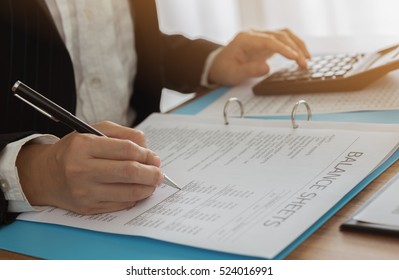 Business women reviewing data in financial statement. Accounting , Accountancy, Bookkeeping Concept. - Powered by Shutterstock