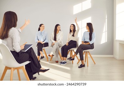 Business women session talk, girls meeting for discussion or training, female group team office interaction. Raising hand to speak, ask at colleague gathering, workshops, coaching to instruct, guide  - Powered by Shutterstock