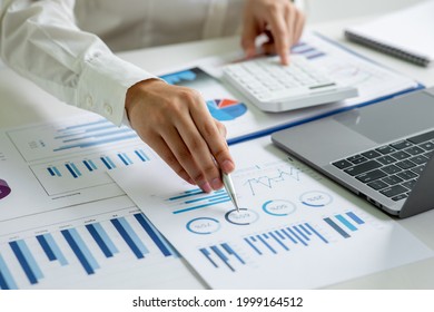 Business women working at charts, spreadsheets, graph financial development, bank accounts, statistics, economy, data analysis, investment analysis, stock exchange concept.