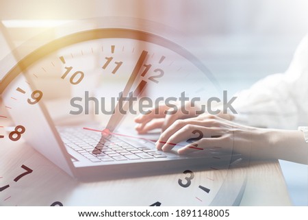 Business working times concept people work typing on laptop computer overlay with in time clock to lunch break
