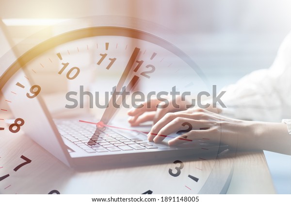 Business working times\
concept people work typing on laptop computer overlay with in time\
clock to lunch break