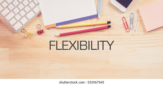 Business Workplace With  FLEXIBILITY Concept On Wooden Background