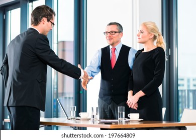 Business - young man in job interview for hiring, welcomes, Boss or Senior and his female Assistant in their office
