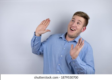 Business Young Man Wearing A Casual Shirt Over White Background Scared With Her Arms Up Like Something Falling From Above