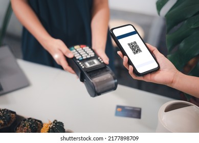 Businesses pay by scanning a QR code in a restaurant,, Customer paying with qr code on smartphone screen NFC payment technology at market shop.. - Shutterstock ID 2177898709