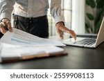 Businessman Accountant analyzing investment charts Invoice and pressing calculator buttons over documents. Accounting Bookkeeper Clerk Bank Advisor And Auditor 