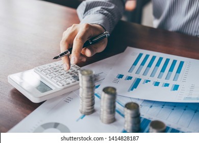 Businessman Accountant Counting Money And Making Notes At Report Doing Finances And Calculate About Cost Of Investment And Analyzing Financial Data, Financing Accounting Banking Concept.