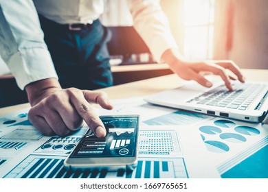 Businessman Accountant Or Financial Expert Analyze Business Report Graph And Finance Chart At Corporate Office. Concept Of Finance Economy, Banking Business And Stock Market Research.