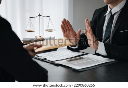 Businessman or accountant is rejecting and resisting partner bribery deals in joint financial settlement, illegal anti-bribery ideas. In work Foto stock © 