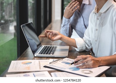 Businessman accountant and secretary making working audit and calculating expense financial annual financial report balance sheet statement, doing finance making notes on paper checking inspection.