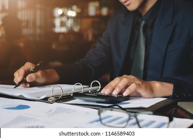 Businessman or Accountant working with calculator for investigation of corruption account. Anti Bribery concept. - Shutterstock ID 1146589403