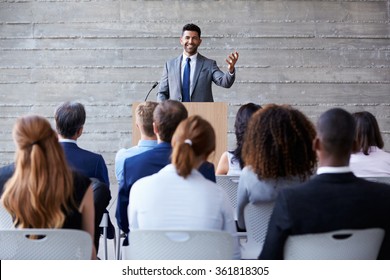 Businessman Addressing Delegates At Conference