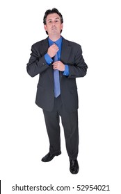 Businessman adjusting his tie isolated over white with a clipping path