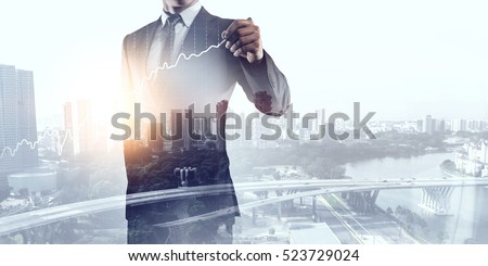 Businessman against modern city background . Mixed media