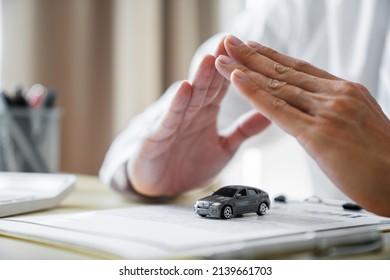 Businessman agent meeting customer with insurance policy about car contract.Salesman Automobile Vehicles Concept. - Shutterstock ID 2139661703