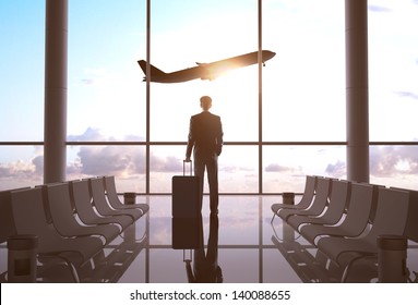 businessman in airport and airplane in sky