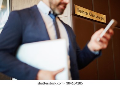 Businessman At Airport In Business Class Lounge