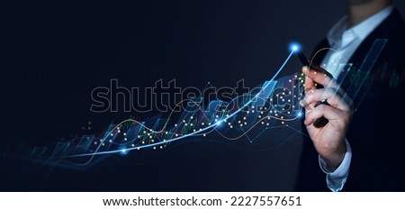 Businessman analysing economic growth graph financial data. Stock market investment. Financial and banking Technology. Business strategy and digital marketing concept.	
