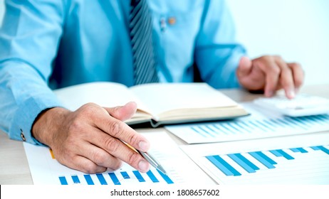 Businessman Analysis The Chart With Laptop At The Office For Setting Challenging Business Goals And Planning To Achieve The New Target.