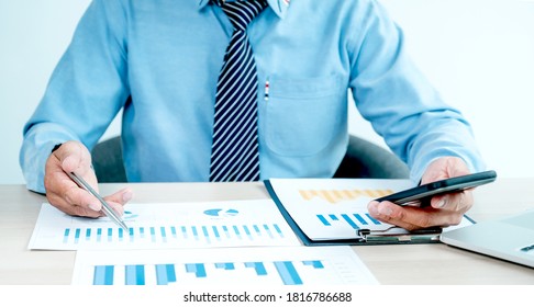 Businessman analysis the chart with laptop at the office for setting challenging business goals And planning to achieve the new target. - Shutterstock ID 1816786688