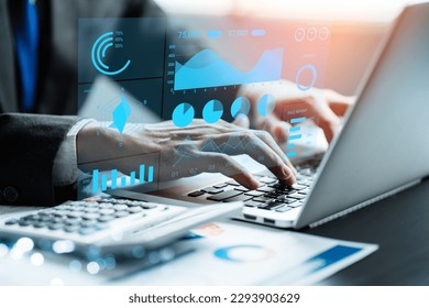 Businessman analysis to charts and data business on a visual screen dashboard with laptop, technology devices and screens visible in the background, financial planning, market research, stock market.