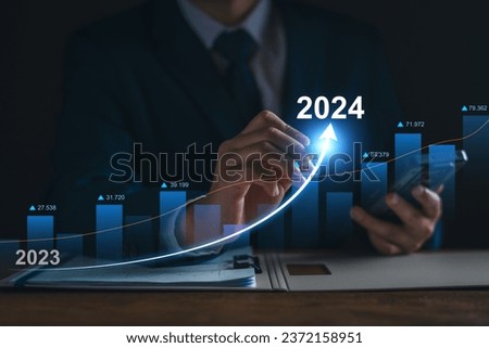 Businessman analysis profitability of working companies with digital augmented reality graphics, positive indicators in 2024, businessman calculates financial data for long-term investments. Stock fotó © 