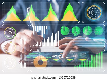 Businessman Analysis Trading Diagram At Tablet Computer. Statistical Model Prediction To Provide Insights For Financial And Marketing Strategy Decisions. Financial Infographics At Virtual Screen.