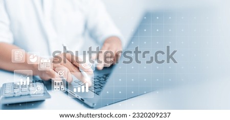 Businessman or Analyst use computer to make a report with KPI and charts. Marketing Analytics and Data Management System concept. Corporate strategy and business model for finance, operations, sales.