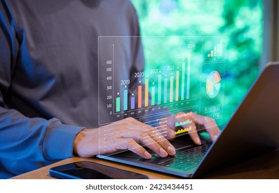 Businessman or Analyst using KPI dashboard on screen with business analytics and data management system of the company. Corporate strategy for finance, market, Financial data report graph concept.