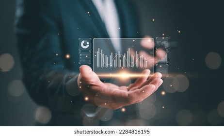 Businessman or Analyst working with Business Analytics and Data Management System on virtual screen, make a report with KPI and metrics. Corporate strategy for finance, operations, sales, marketing.