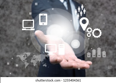 Businessman and  analytics symbol on  background - Shutterstock ID 1255404361