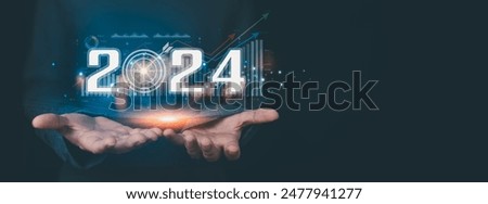 Businessman analyzes business growth plan in 2024, digital marketing strategy, revenue, profit, economy, stock market and business trends. Technical Analysis Strategies Using Future AI Technology