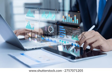 Businessman analyzes an interactive data dashboard with bar charts, pie charts, KPI and visual reports to evaluate performance, support financial insights, and drive strategic business decisions.