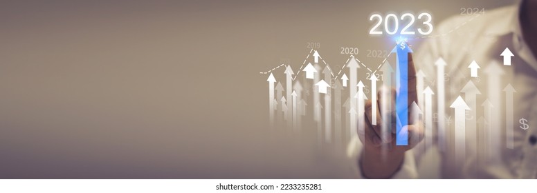  Businessman analyzes performance profitability of working companies with digital augmented reality graphics, positive indicators in 2023, businessman calculates financial data for investment - Shutterstock ID 2233235281