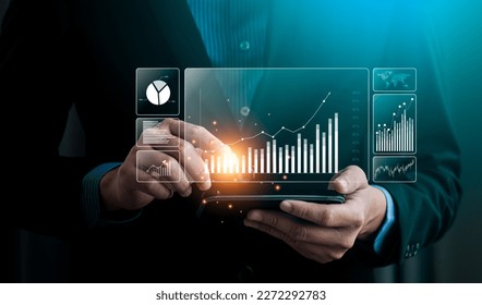 Businessman analyzing business enterprise data management, Business analytics with charts, metrics and KPIs to performance organization. Corporate strategy for finance, operations, sales, marketing - Powered by Shutterstock