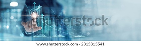 Businessman analyzing and calculating financial data for long term investment growth goals and company finance balance, Business strategy and planning of target. Economic analysis of Digital marketing