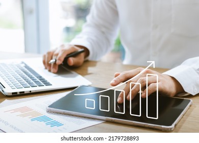 Businessman Analyzing Company's Financial Balance Sheet Working With Digital Augmented Reality Graphics. Businessman Calculates Financial Data For Long-term Investment.