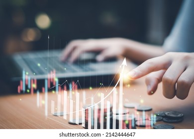Businessman analyzing financial data with virtual graphs, concepts, technology, business, finance, investments, stocks, traders, digital assets.