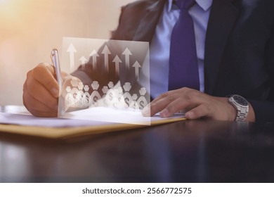 Businessman analyzing financial growth data, with futuristic overlay of upward arrows and dollar symbols. Concept of investment, profit, economic success, and strategic planning in modern business.