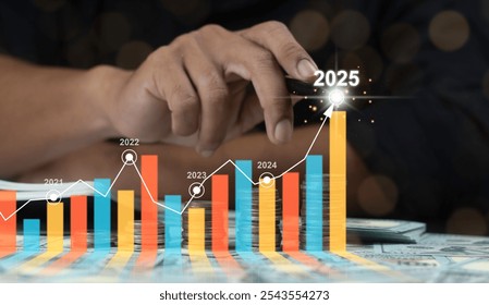 Businessman analyzing financial performance and profitability growth trends. Concept of 2025 business financial plan, market strategies, and revenue increase. - Powered by Shutterstock